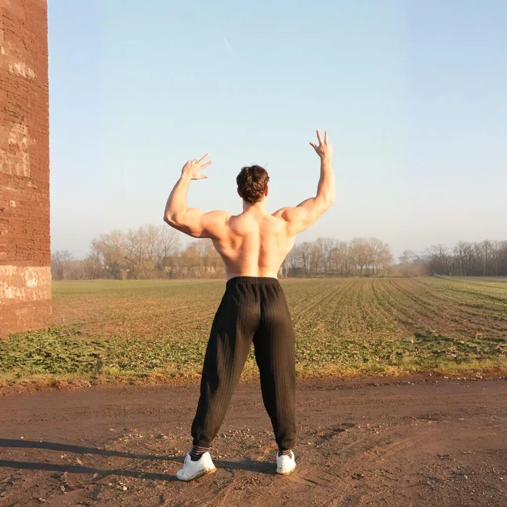 Coach Brik Back Pose Authority